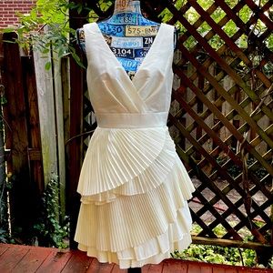 Max and Cleo satin cream dress. Pleated skirt, never worn. Excellent condition.